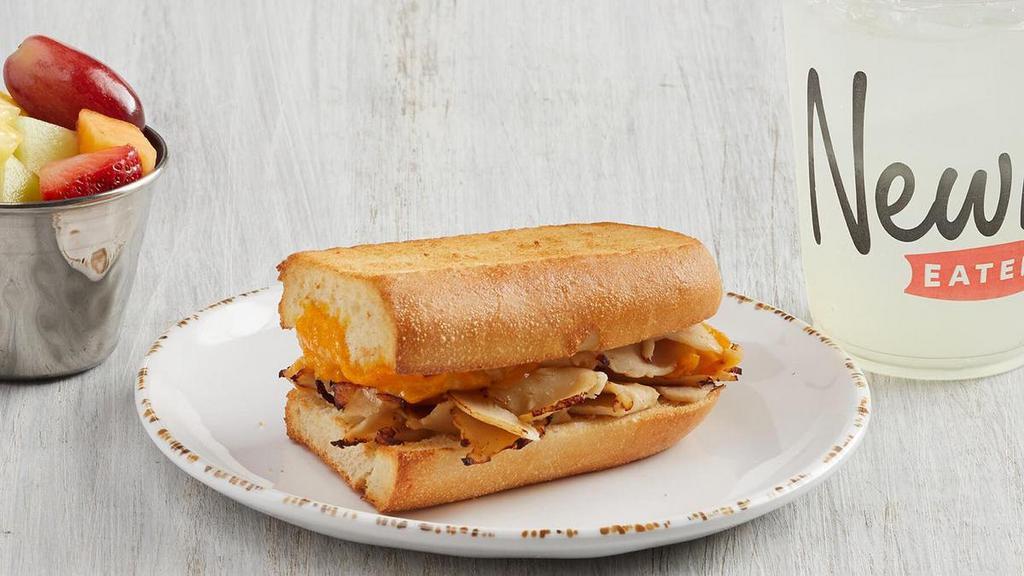 Kid'S Toasted Turkey & Cheese · Oven-roasted turkey and aged cheddar cheese served warm on French Parisian bread with choice of fruit (45 cal), applesauce (40 cal) or bag of chips (140-300 cal). For kids 12 and under. Includes kid’s fountain beverage (0-170 cal), apple juice (100 cal) or whole milk (150 cal).