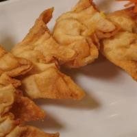 Crab Rangoon · Crispy wontons with cream cheese and a curry-seasoned mix of real and imitation crab.
