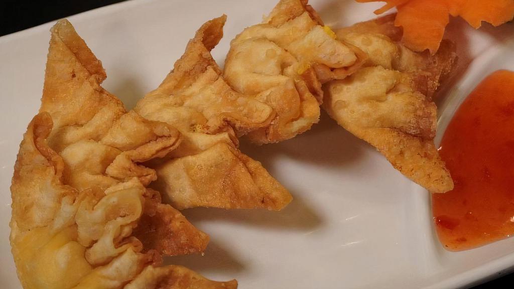 Crab Rangoon · Crispy wontons with cream cheese and a curry-seasoned mix of real and imitation crab.