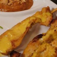 Chicken Satay · Marinated and grilled in curry spices; served with peanut sauce.