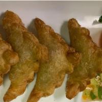 Thai Mini Curry Puff · Mini pastry filled with minced curry-chicken and potatoes; served with sweet chili sauce.