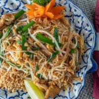 Pad Thai (Thailand'S Signature Dish) · Rice noodles stir-fried with tamarind sauce, egg, tofu and bean sprouts.