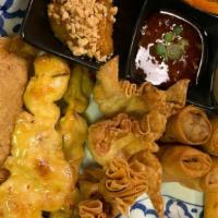 Thai Sampler - 1 · Two spring rolls, two crab rangoon, two lumpia, two golden money bags, two satay, and one mi...