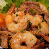 Tiger Cried · Thai grilled beef slices blended with Thai dry chili spices and fresh herbs. Add shrimp for ...