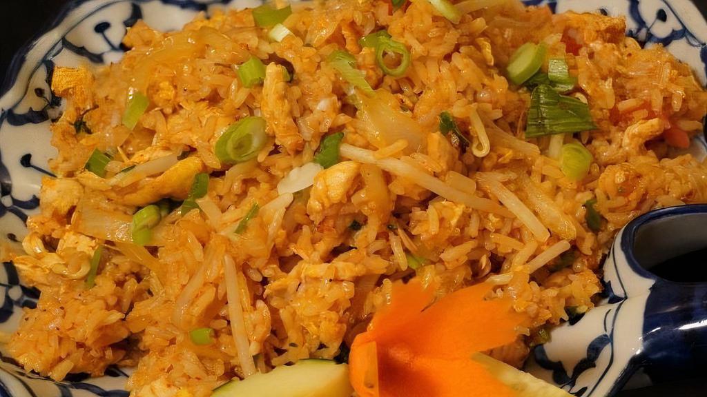 Indonesian Curry Fried Rice · Saffron, turmeric onion, garlic, egg, carrots, green beans, and sprouts.