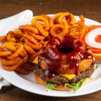 Cowboy Burger · Topped with American cheese, bbq sauce, and onion ring. Served with lettuce, tomato, onions,...