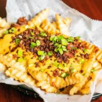 Loaded Fries · Topped with chili, cheese sauce, and bacon.