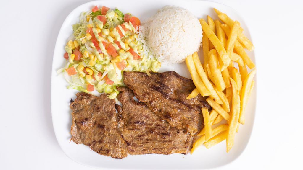 Carne Asada / Grilled Beef · Carne a la parrilla con arroz, patatas fritas y ensalada. / Grilled steak with rice, french fries and salad.