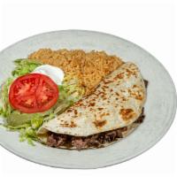 Quesadilla Mexicana · A cheese quesadilla filled with your choice of steak or grilled chicken. Served with lettuce...