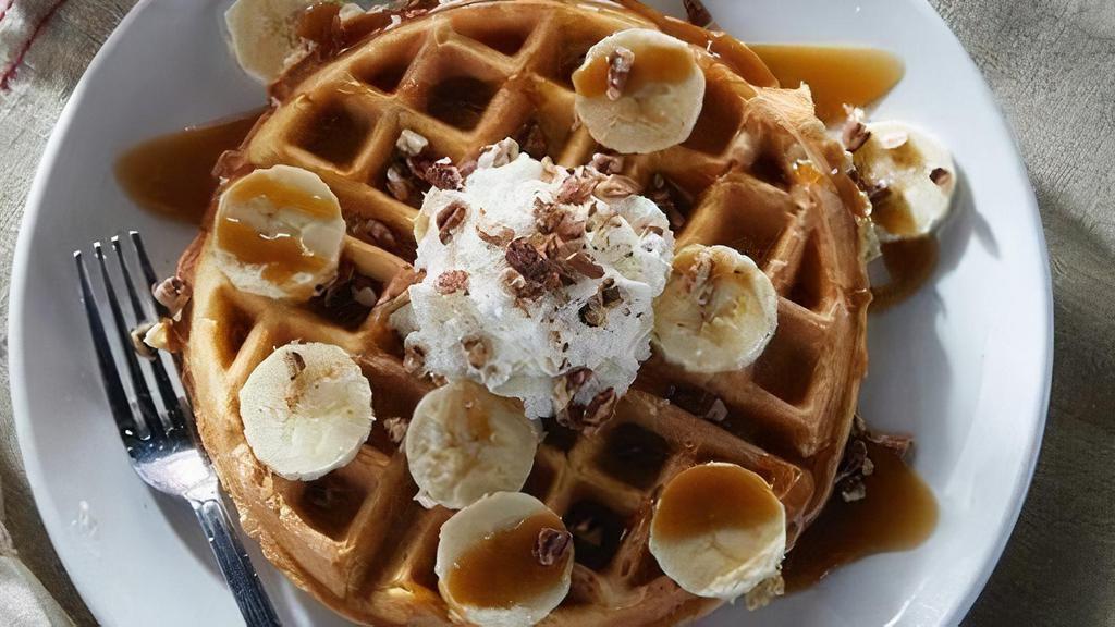 Bourbon Street Waffle · Belgian waffle topped with bananas, pecans, rum butter sauce drizzle and fresh whipped cream.