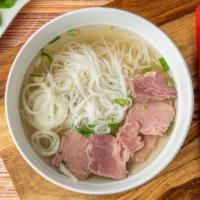 Pho Noodle Soup · Beef rice noodle in beef broth with lime, beef, onion and bean sprout.