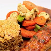 Tamarind Glaze Salmon · Seared salmon glazed in our tamarind sauce and crusted to perfection, served with your choic...