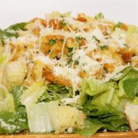 Chicken Caesar Salad · Grilled chicken served on a bed of romaine with grated Parmesan and Parmesan croutons.
