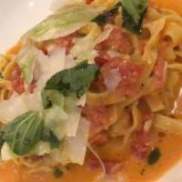 House-Made Fettuccini · tomato cream sauce, fresh basil, parmesan; vegetarian