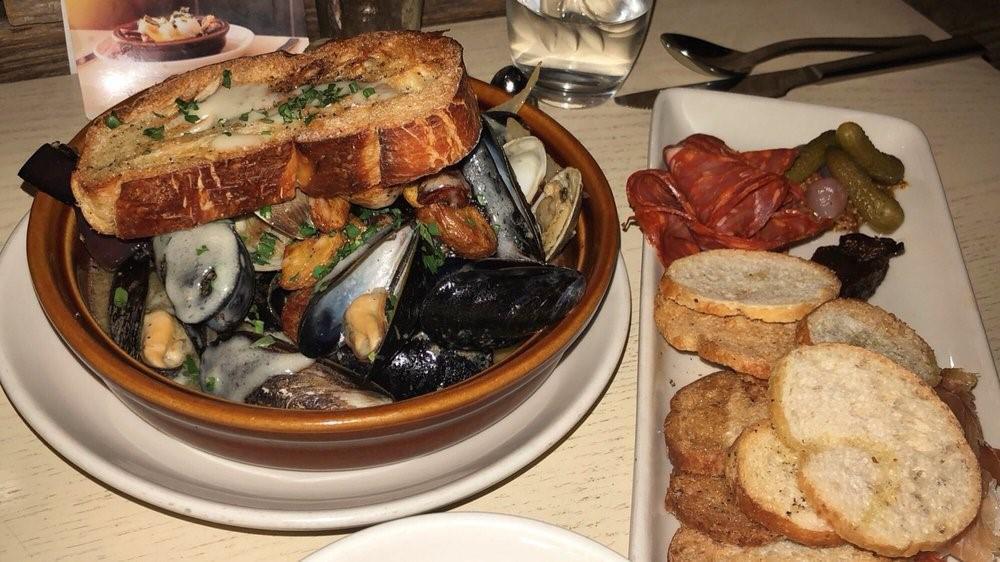 Sautéed Mussels And Clams · basil and pine nut pesto, calabrian chili, white wine butter sauce, garlic bread; may be prepared gluten-free upon request
