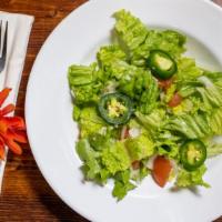 House Salad
 · Lettuce, tomatoes, onions, and jalapeño topped with Abol dressing.