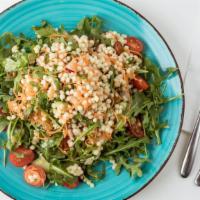 Couscous Salad · Pearl couscous with cherry tomatoes, cucumbers, carrots, red radishes, arugula, golden raisi...
