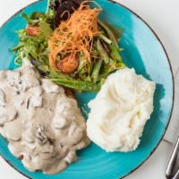 Mushroom Sauce · Creamy sauce made with white wine and fine herbs, topped with goat cheese.
