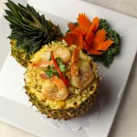 Pineapple Fried Rice · Thai Fried Rice with Cumin Flavour, Pineapple, Cashew Nut with Chicken and Shrimp.