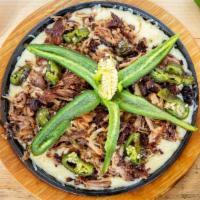 Joe'S Dip · shredded pork carnitas on a bed of melted queso. Served with fried jalapeño and flour tortil...