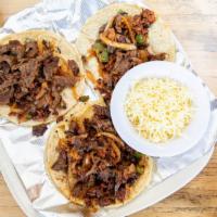 Tacos Especiales · Three corn tortillas filled with grilled steak, onions, jalapeños, chorizo spicy mexican sau...