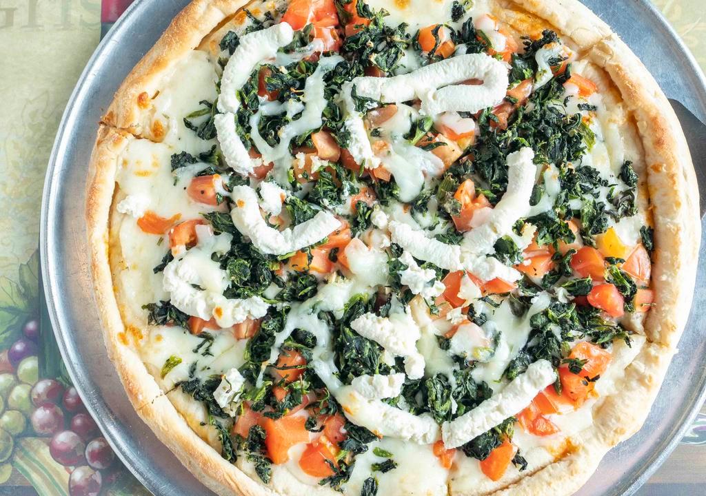 White Pizza · Ricotta cheese, pecorino cheese, garlic, spinach, fresh tomatoes, oregano, basil and mozzarella cheese.