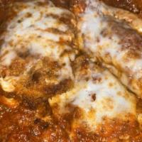 Chicken Parmigiana Lunch · Hand breaded chicken covered with homemade marinara, baked with mozzarella and served with p...