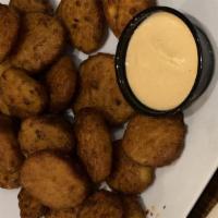Asian Spice Fried Pickles · Fried pickles tossed in chef’s blend of Korean spices,
served with Sriracha mayo