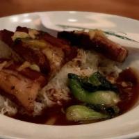 Pork Belly Rice Bowl · Dry-rubbed and roasted pork belly served with
rice, bok choy, and gravy
