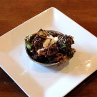 Crispy Brussels Sprouts · Crispy fried brussels sprouts with honey and
sour cream aioli