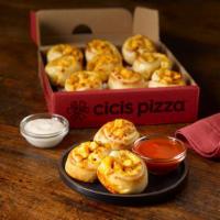Buffalo Chicken Poppers · Fresh dough rolled with buffalo pizza sauce, chicken and 100% real cheese, then baked to per...