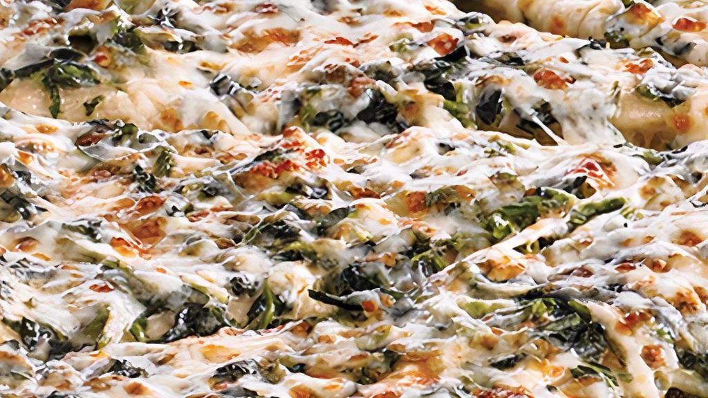 Spinach Alfredo · Traditional crust brushed with garlic butter and topped with creamy Alfredo sauce blended with spinach and 100% real cheese. . Medium and Large: 10 slices. Giant, Deep Dish, Flatbread, and Stuffed Crust: 12 slices.  *Calories listed are by slice