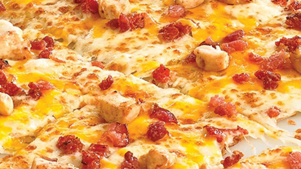 Chicken Bacon Club · Traditional crust topped with 100% Real Cheddar Cheese, Premium Chicken, Bacon and Bruschetta Tomatoes with zesty Parmesan Ranch.. Medium and Large: 10 slices. Giant, Deep Dish, Flatbread, and Stuffed Crust: 12 slices.  *Calories listed are by slice