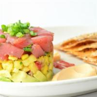 Ahi Tuna Stack · Diced Ahi tuna tossed with ginger lime and cilantro stacked atop avocado, roasted corn, and ...