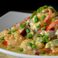 Shrimp And Grits · Shrimp, andouille sausage, peppers, onion, over cheese grits