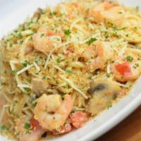 Shrimp Linguini · Sauteed shrimp, basil cream, homemade boursin, mushroom, green onion, tomato, garlic