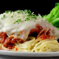 Chicken Parmesan · Hand breaded chicken, marinara, provolone and parmesan, linguini, choice of side item