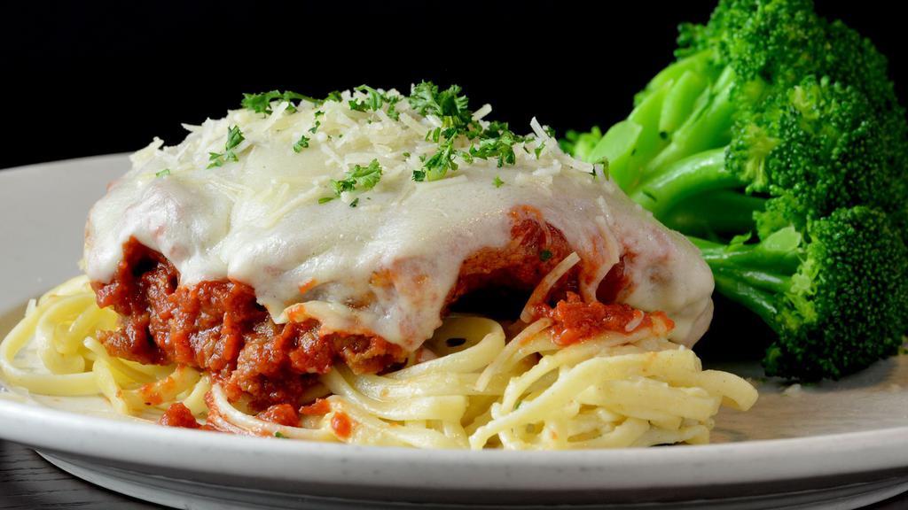 Chicken Parmesan · Hand breaded chicken, marinara, provolone and parmesan, linguini, choice of side item