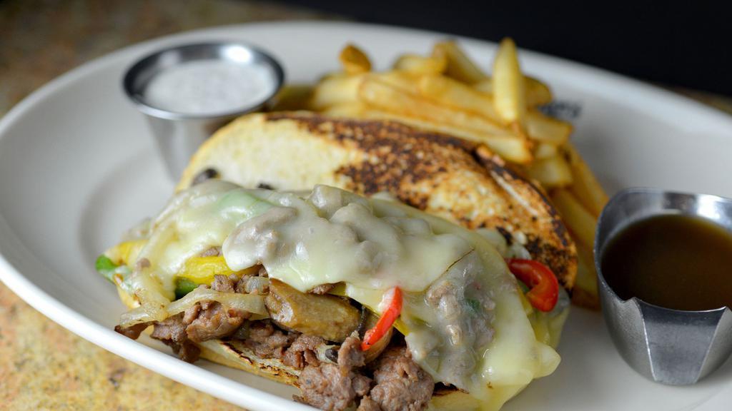 Philly Style Cheesesteak · Hoagie bun, peppers, onion, mushrooms, provolone, choice of side item