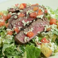 Steak Caesar Salad · Thinly sliced sirloin, diced tomato, onion, crumbled blue cheese, romaine, crouton, eggless ...