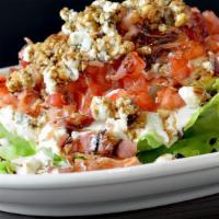 Wedge Salad · Baby iceberg, crumbled blue cheese, diced tomato, bacon, sweet red wine reduction, blue chee...