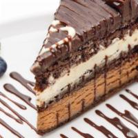 Chocolate Mousse Cake · White & dark chocolate mousse between rich chocolate cake topped with chocolate ganache and ...