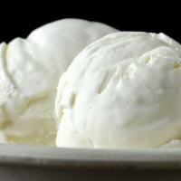 Homemade Vanilla Bean Ice Cream · One oversized scoop of our homemade vanilla bean ice cream