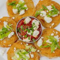 Fried Green Tomatoes · Topped with tomato chutney a goat cheese.