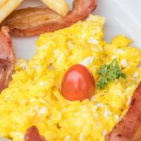 Scrambled Eggs & Bacon · Includes  fries Toast & Coffee.