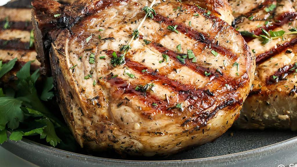 Pork Chop · Delicious Pork Chop on the grill, with 2 sides of your choice, always fresh and juicy!