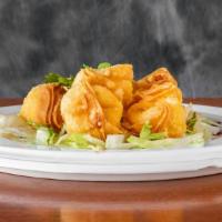 Cheese Wontons · 8 pieces. Sweet cream cheese in a fried wonton shell.