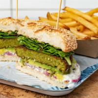 Baerut Burger · The original veggie burger. Falafel patty, mixed greens, avocado, onion, tzatziki served on ...