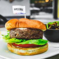 Impossible Burger · Eight ounces of plant based patty with lettuce, tomato, vegan ranch on a vegan brioche bun.