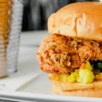 303 Chicken Sandwich · Grilled or fried chicken breast with green tomato relish, cucumber quickles and coop sauce